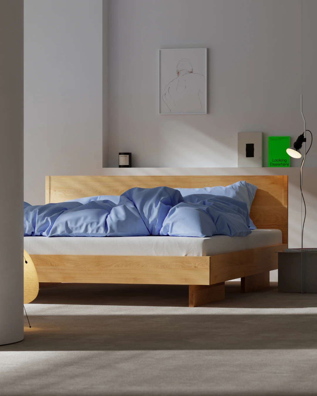 Bett mit blauer Bettw&auml;sche